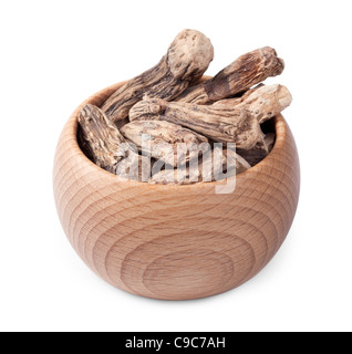 Wooden bowl full of dry calamus root isolated on white background Stock Photo