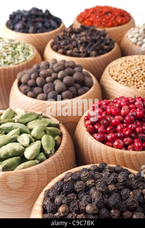 Wooden bowls full of different spices and herbs Stock Photo