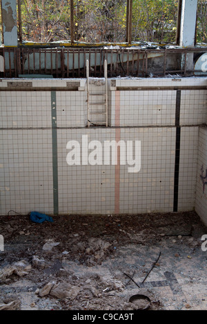 The abandoned and derelict Azure swimming pool in Pripyat Chernobyl Exclusion Zone Ukraine Stock Photo