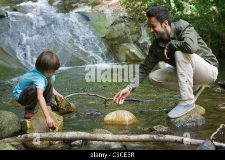 Father and son exploring nature Stock Photo