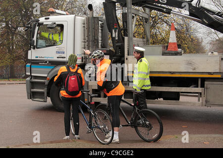 Metropolitan Police traffic officers offer practical advice and offer cyclists a drivers eye view of a bike from the cab of a large vehicle, during the latest of a long running series of Exchanging Places cycle safety event. Coinciding with London's Road Safety week, Metropolitan Police traffic offi Stock Photo