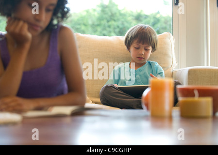 Boy reading e-book Stock Photo