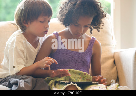Children using digital tablet Stock Photo