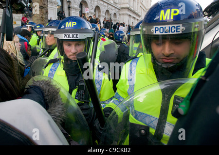 Police in riot gear resisting protestors on Whitehall, Day X Student Demonstration, 24 November 2010, London, England Stock Photo