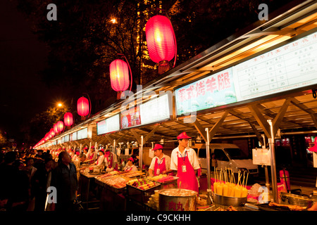 serving exotic food at the Wangfujing night market, Beijing,PRC Peoples Republic of China, Asia Stock Photo