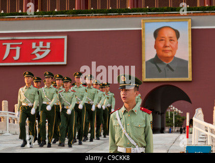 Chinese soldiers marching from the Tiananmen Tower under Chairman Mao's portrait, Gate of Heavenly Peace, Beijing, China, Asia Stock Photo