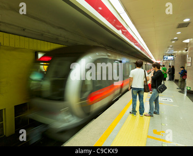 Commuters waiting for the metro train to stop  Beijing metro Beijing District, China, PRC, people's republic of China asia Stock Photo