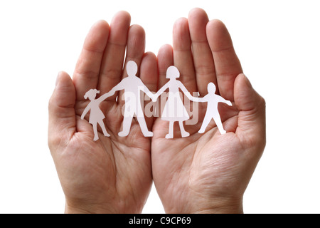 Paper chain family protected in cupped hands Stock Photo