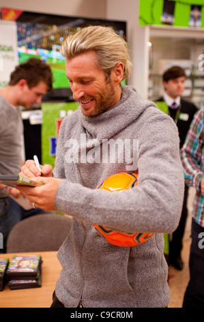 Robbie Savage arrived at Asda Spondon in Derby, UK on Tuesday 22nd December for the signing of his DVD Football Howlers”. Hundreds of fans arrived to see Robbie who was a former Derby County football player. Some of which had been queuing since 10am. He is currently dancing alongside Ola Jordan in  Stock Photo