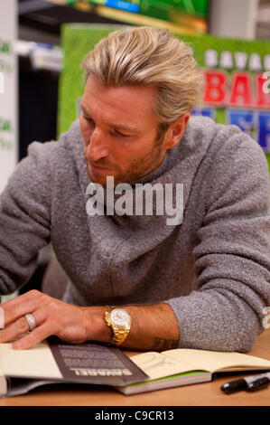 Robbie Savage arrived at Asda Spondon in Derby, UK on Tuesday 22nd December for the signing of his DVD Football Howlers”. Hundreds of fans arrived to see Robbie who was a former Derby County football player. Some of which had been queuing since 10am. He is currently dancing alongside Ola Jordan in  Stock Photo