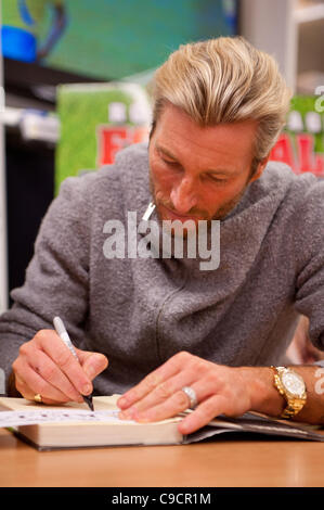 Robbie Savage arrived at Asda Spondon in Derby, UK on Tuesday 22nd December for the signing of his DVD Football Howlers”. Hundreds of fans arrived to see Robbie who was a former Derby County football player. Some of which had been queuing since 10am. He is currently dancing alongside Ola Jordan in  Stock Photo