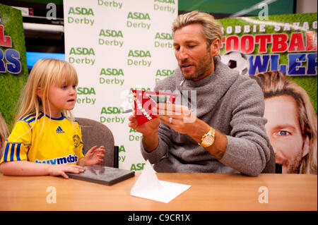 Robbie Savage arrived at Asda Spondon in Derby, UK on Tuesday 22nd December for the signing of his DVD Football Howlers”. Hundreds of fans arrived to see Robbie who was a former Derby County football player. Some of which had been queuing since 10am. He is currently dancing alongside Ola Jordan in  Stock Photo