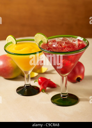 Frozen pomegranate and Spicy Mango Margarita cocktail on ice Stock Photo