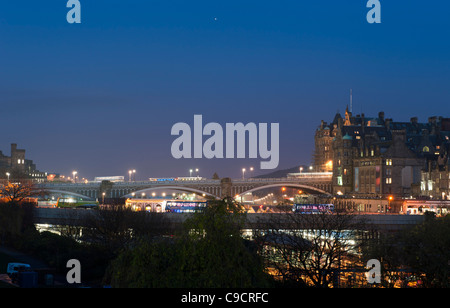 Night view from Princes Street Gardens of the North Bridge and the old Scotsman building in Edinburgh, Scotland. Stock Photo