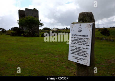Sign warning of subsidence danger due to disused tin mine shafts , near Minions , Bodmin Moor , Cornwall , England