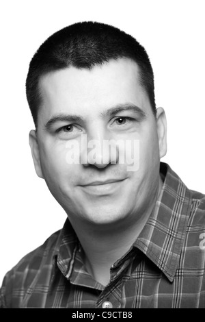 Portrait of a young man in his 30s isolated on white, studio shot. Stock Photo