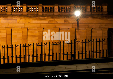 Ornate street lighting photographed after dark on The Mound near Edinburgh's Princes Street. Stock Photo