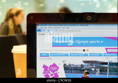 The London 2012 website shot in a coffee shop environment (Editorial use only: print, TV, e-book and editorial website). Stock Photo