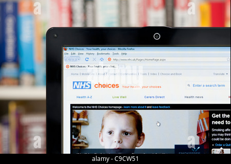 The NHS Choices website shot against a bookcase background (Editorial use only: print, TV, e-book and editorial website). Stock Photo