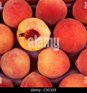 Ruston Red Peaches, whole and half showing stone, Georgia. Stock Photo