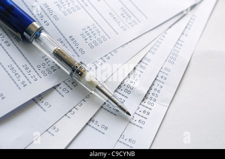 Prints of financial report on a sheets and pen Stock Photo