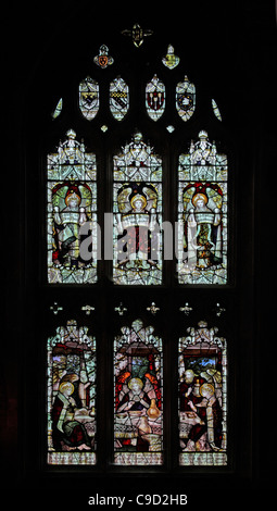 Stained glass window by the Kempe Studios depicting The Hospitality of Abraham; St Mary the Virgin, Cannington, Somerset England Stock Photo