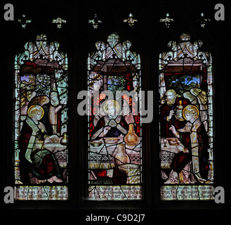 Stained glass window by the Kempe Studios, depicting Abraham entertaining the angels, St Mary the Virgin, Cannington, Somerset England Stock Photo