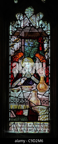 Stained glass window by the Kempe Studios depicting The Hospitality of Abraham Stock Photo