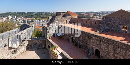 Palatial Residence (Paços Novos) - right - and Nossa Senhora da Pena church - left - in the Leiria Caste. Leiria, Portugal. Stock Photo