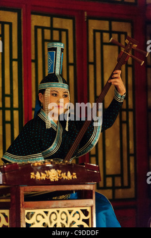 Musician of Tumen Ekh ensemble performs traditional mongolian music in Ulan Bator. Stock Photo