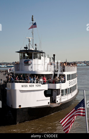 Miss New York, Ferryboat and Visitors, Statue of Liberty and Ellis island, NYC Stock Photo