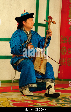 Musician of Tumen Ekh ensemble performs traditional mongolian music in Ulan Bator. Stock Photo