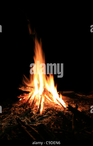 small campfire at night with black background Stock Photo