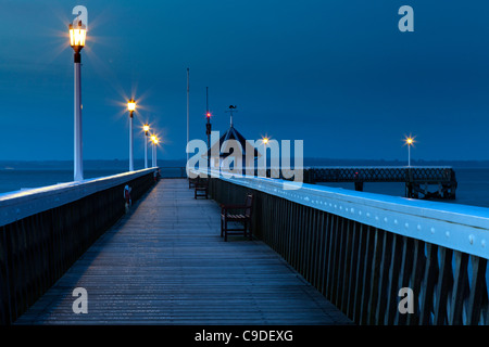 Empty Yarmouth wooden Pier Isle of Wight at dusk Stock Photo