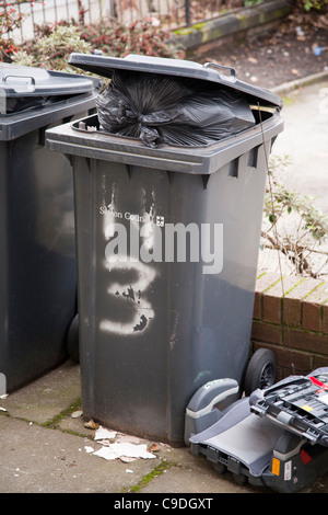 overflowing wheelie bin lid open rubbish waste bin liverpool uk Stock ...