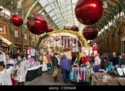 Christmas stalls at Apple Market in Covent Garden London UK Stock Photo