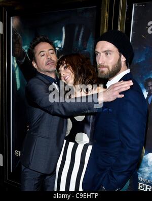 Lead Actor Robert Downey Jr., Noomi Rapace and Jude Law attends the European Premiere of Sherlock Holmes: A Game of Shadows at The Empire, Leicester Square on Thursday 8th December 2011. Persons pictured: Robert Downey Jr., Noomi Rapace and Jude Law. Picture by Julie Edwards Stock Photo