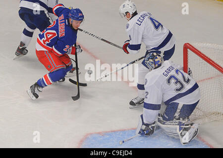 Dec. 08, 2011 - New York, New York, U.S - New York Rangers right wing Ryan Callahan (24) takes a shot on goal at Tampa Bay Lightning goalie Mathieu Garon (32) past the defending center Vincent Lecavalier (4) during second period NHL action between the Tampa Bay Lightning and the New York Rangers at  Stock Photo