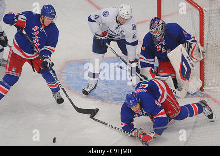 Dec. 08, 2011 - New York, New York, U.S - New York Rangers defenseman Dan Girardi (5) blocks a shot in front of goalie Henrik Lundqvist (30) and Tampa Bay Lightning center Vincent Lecavalier (4) during third period NHL action between the Tampa Bay Lightning and the New York Rangers at Madison Square Stock Photo