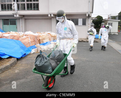 December 8, 2011, Namie-machi, Japan - Japan's Ground Self-Defense Force starts preparation work for a decontamination operation at the Namie-machi town hall in Fukushima Prefecture, 230km northeast of Tokyo. About 900 GSDF troops began cleanup operations at local government buildings in the area. Stock Photo