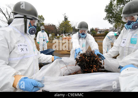 December 8, 2011, Namie-machi, Japan - Japan's Ground Self-Defense Force starts preparation work for a decontamination operation at the Namie-machi town hall in Fukushima Prefecture, 230km northeast of Tokyo. About 900 GSDF troops began cleanup operations at local government buildings in the area. Stock Photo