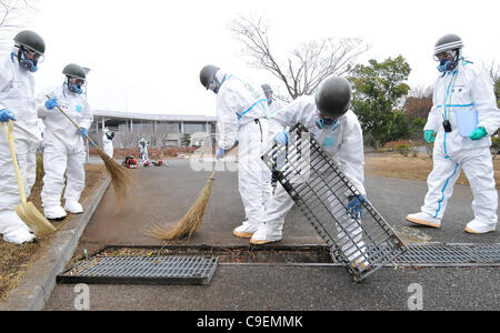 December 8, 2011, Namie-machi, Japan - Japan's Ground Self-Defense Force starts preparation work for a decontamination operation at the Namie-machi town hall in Fukushima Prefecture, 230km northeast of Tokyo. About 900 GSDF troops began cleanup operations at local government buildings in the area. Stock Photo