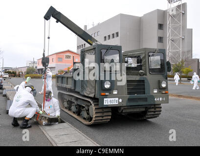 December 8, 2011, Namie-machi, Japan - Japan's Ground Self-Defense Force starts preparation work for a decontamination operation at the Namie-machi town hall in Fukushima Prefecture, 230km northeast of Tokyo. About 900 GSDF troops began cleanup operations at local government buildings in the area. Stock Photo