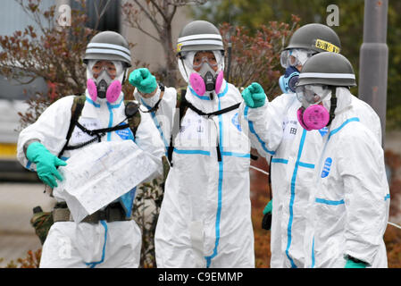 December 8, 2011, Namie-machi, Japan - Japan's Ground Self-Defense Force starts preparation work for a decontamination operation at the Namie-machi town hall in Fukushima Prefecture, 230km northeast of Tokyo. About 900 GSDF troops began cleanup operations at local government buildings in the area. Stock Photo