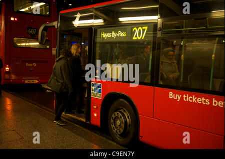 Final days of the bendy Bus: A route 207 bendy bus is seen on 8th December 2011 at Shepherd's bush bus station. Transport for London (TfL) confirmed that Friday 9th December will be the final day of the bendy bus being seen in service on the streets of London as they are removed and replaced by doub Stock Photo