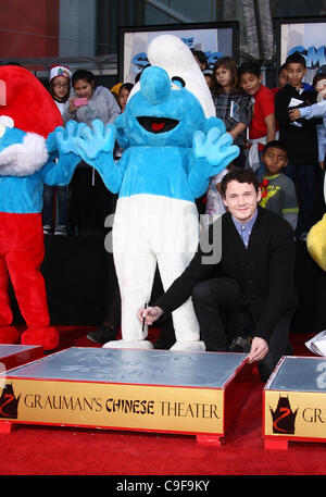 CLUMSY & ANTON YELCHIN THE SMURFS HONORED WITH HAND AND FOOTPRINTS HOLLYWOOD LOS ANGELES CALIFORNIA USA 13 December 2011 Stock Photo