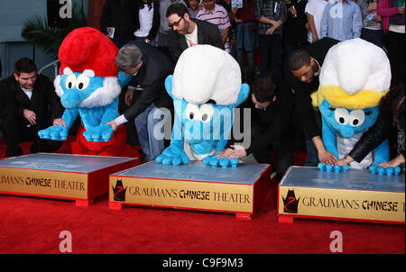 PAPA SMURF & CLUMSY & ANTON YELCHIN & SMURFETTE THE SMURFS HONORED WITH HAND AND FOOTPRINTS HOLLYWOOD LOS ANGELES CALIFORNIA Stock Photo