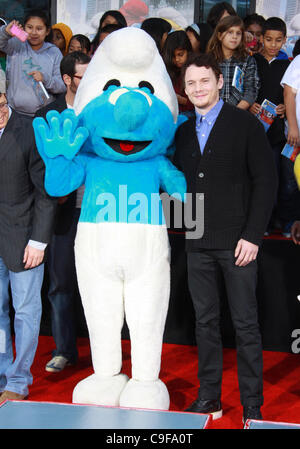 Dec. 13, 2011 - Los Angeles, California, U.S. - Anton Yelchin and Clumsy.The ''SMURFS'' Honored with Hand and Footprint Ceremony  held at  The Grauman's Chinese Theatre,Los Angeles,CA. December 13-2011.(Credit Image: Â© TLeopold/Globe Photos/ZUMAPRESS.com) Stock Photo