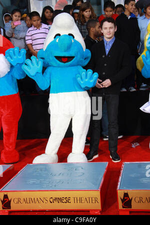 Dec. 13, 2011 - Los Angeles, California, U.S. - Anton Yelchin and Clumsy.The ''SMURFS'' Honored with Hand and Footprint Ceremony  held at  The Grauman's Chinese Theatre,Los Angeles,CA. December 13-2011.(Credit Image: Â© TLeopold/Globe Photos/ZUMAPRESS.com) Stock Photo