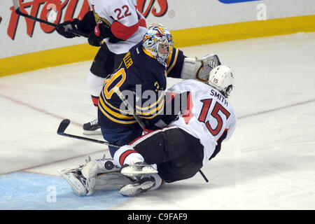 Dec. 13, 2011 - Buffalo, New York, U.S - Buffalo Sabres goalie Ryan Miller (30) makes the save with his pad as Ottawa Senators left wing Zack Smith (15) runs into him in the first period at the First Niagara Center in Buffalo, NY.  Buffalo leads Ottawa 2-1 after the first period. (Credit Image: © Mi Stock Photo